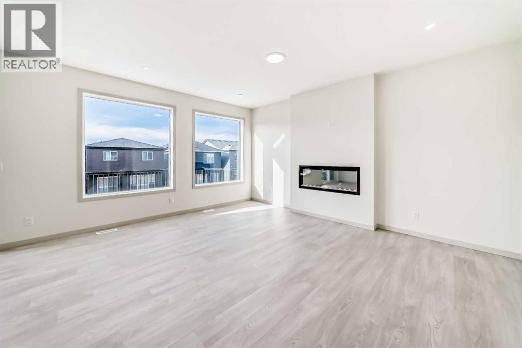31 Lucas Passage Nw, Calgary, AB - Indoor Photo Showing Living Room With Fireplace