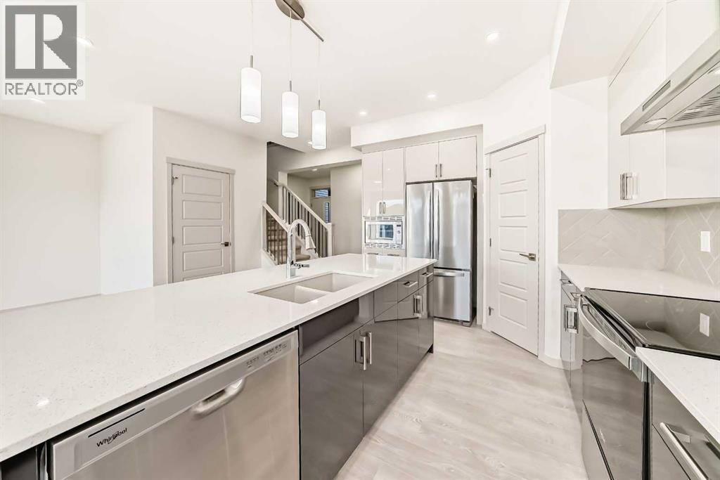 31 Lucas Passage Nw, Calgary, AB - Indoor Photo Showing Kitchen With Double Sink With Upgraded Kitchen