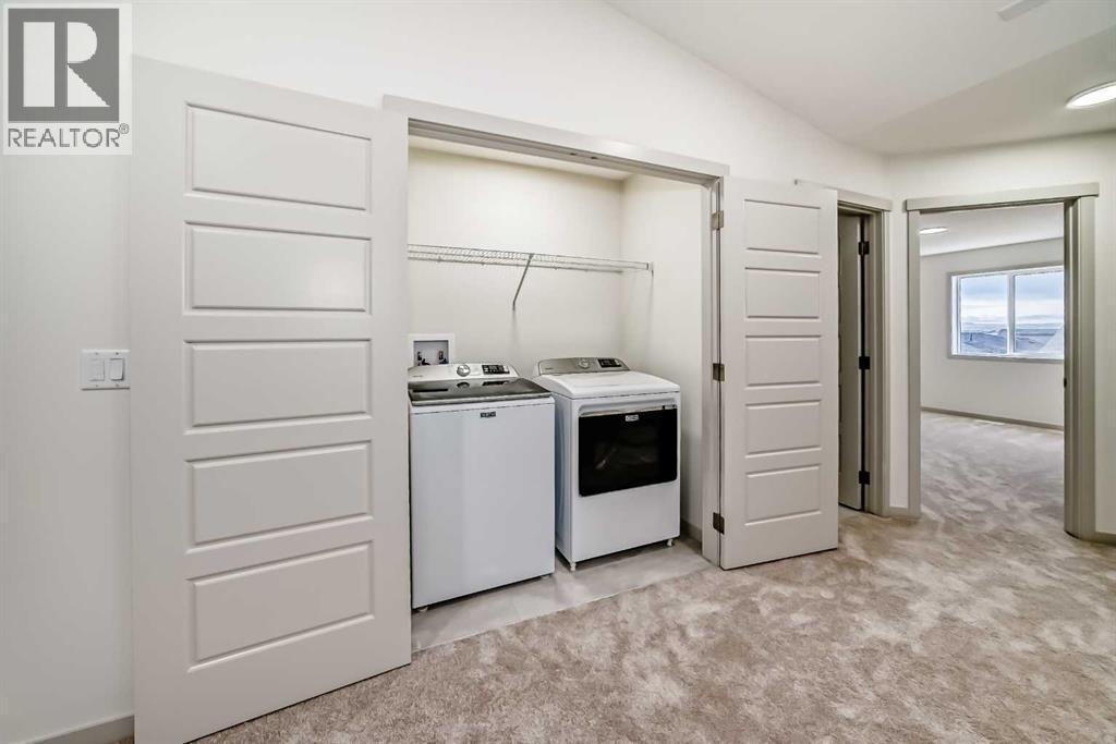 31 Lucas Passage Nw, Calgary, AB - Indoor Photo Showing Laundry Room