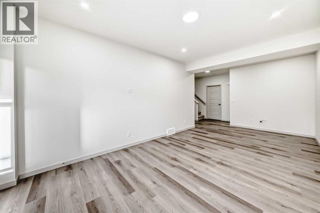 31 Lucas Passage Nw, Calgary, AB - Indoor Photo Showing Other Room
