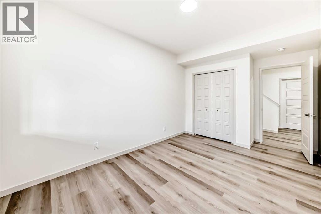 31 Lucas Passage Nw, Calgary, AB - Indoor Photo Showing Other Room