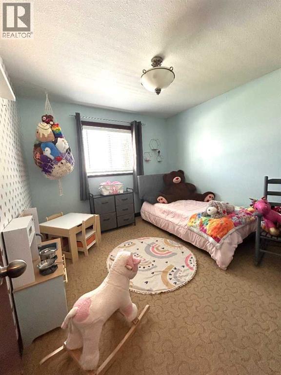 223 15 Street E, Brooks, AB - Indoor Photo Showing Bedroom
