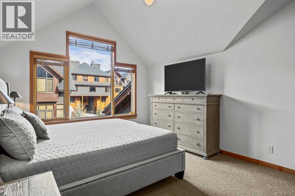 7 Creekside Mews, Canmore, AB - Indoor Photo Showing Bedroom
