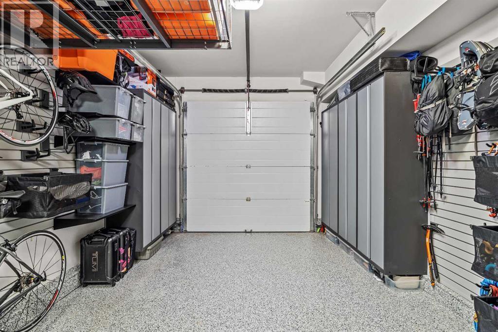 7 Creekside Mews, Canmore, AB - Indoor Photo Showing Garage