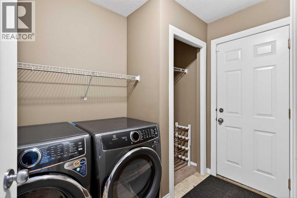 69 Elkton Way Sw, Calgary, AB - Indoor Photo Showing Laundry Room