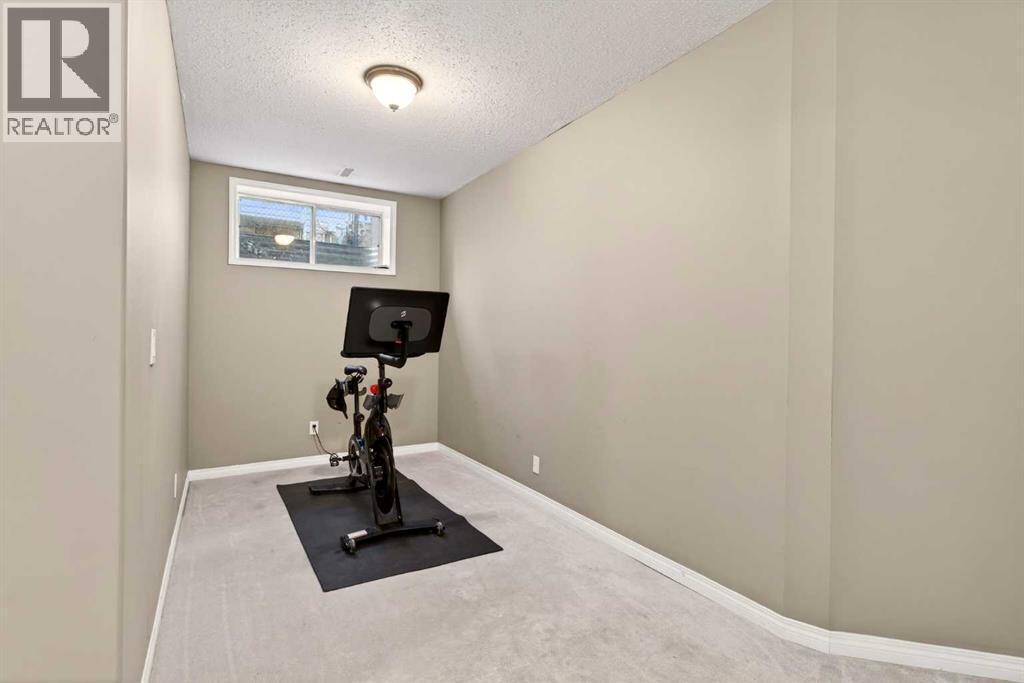 69 Elkton Way Sw, Calgary, AB - Indoor Photo Showing Gym Room