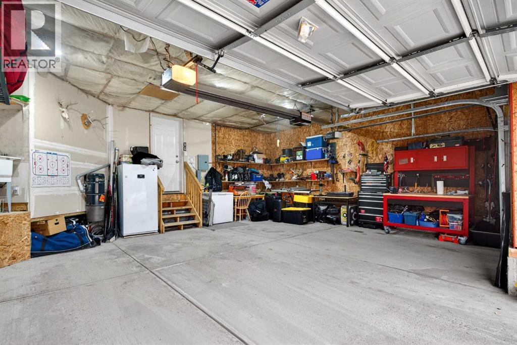 69 Elkton Way Sw, Calgary, AB - Indoor Photo Showing Garage