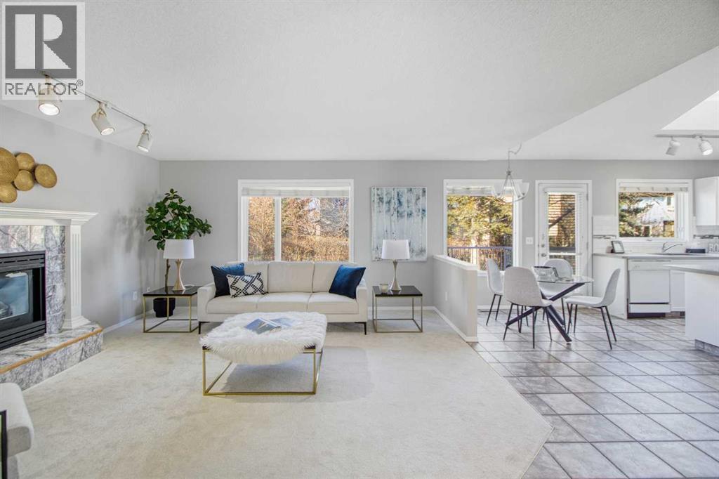134 Hamptons Heath Nw, Calgary, AB - Indoor Photo Showing Living Room With Fireplace