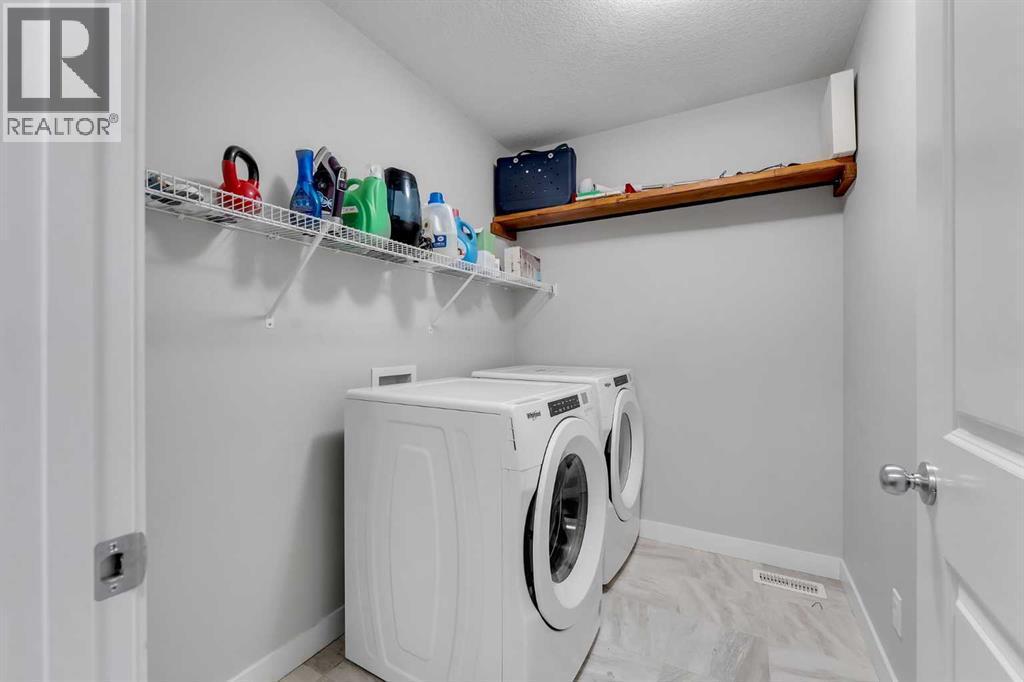 39 Savanna Way Ne, Calgary, AB - Indoor Photo Showing Laundry Room