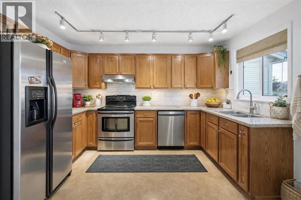 24 Laguna Close Ne, Calgary, AB - Indoor Photo Showing Kitchen With Double Sink