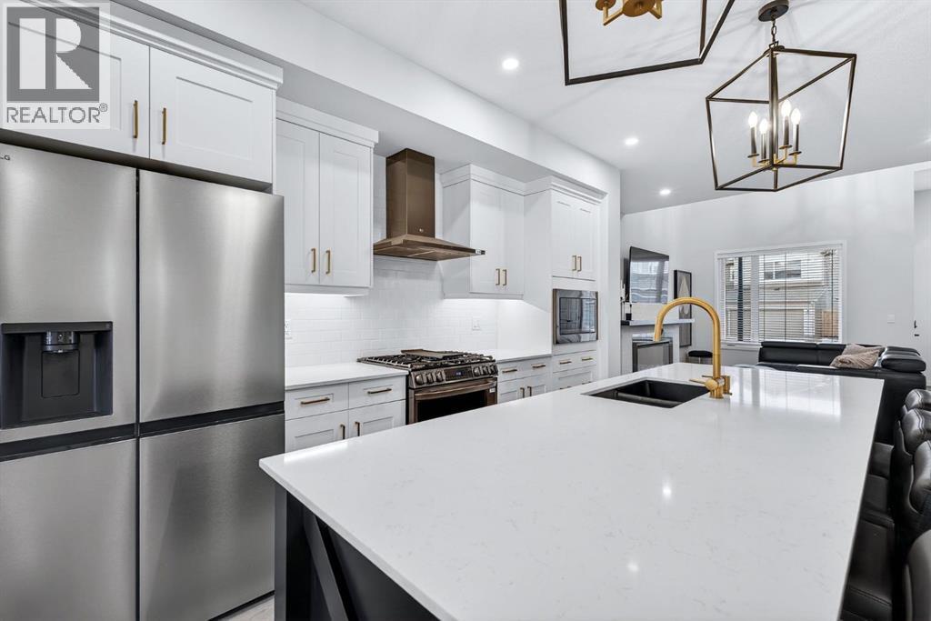 413 Belmont Park Sw, Calgary, AB - Indoor Photo Showing Kitchen With Stainless Steel Kitchen With Double Sink With Upgraded Kitchen