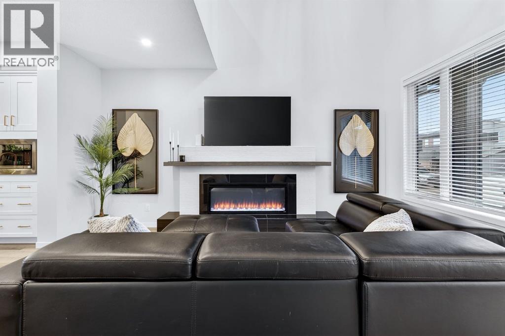 413 Belmont Park Sw, Calgary, AB - Indoor Photo Showing Living Room With Fireplace