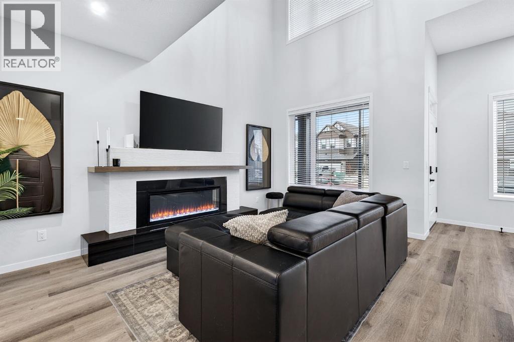 413 Belmont Park Sw, Calgary, AB - Indoor Photo Showing Living Room With Fireplace