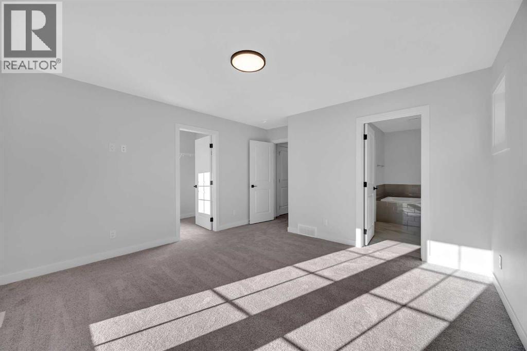 26 Versant Path Sw, Calgary, AB - Indoor Photo Showing Other Room
