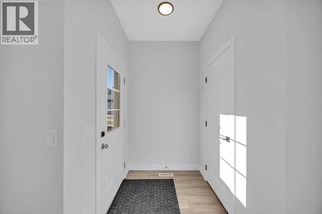 26 Versant Path Sw, Calgary, AB - Indoor Photo Showing Other Room