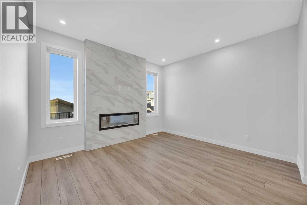 26 Versant Path Sw, Calgary, AB - Indoor With Fireplace