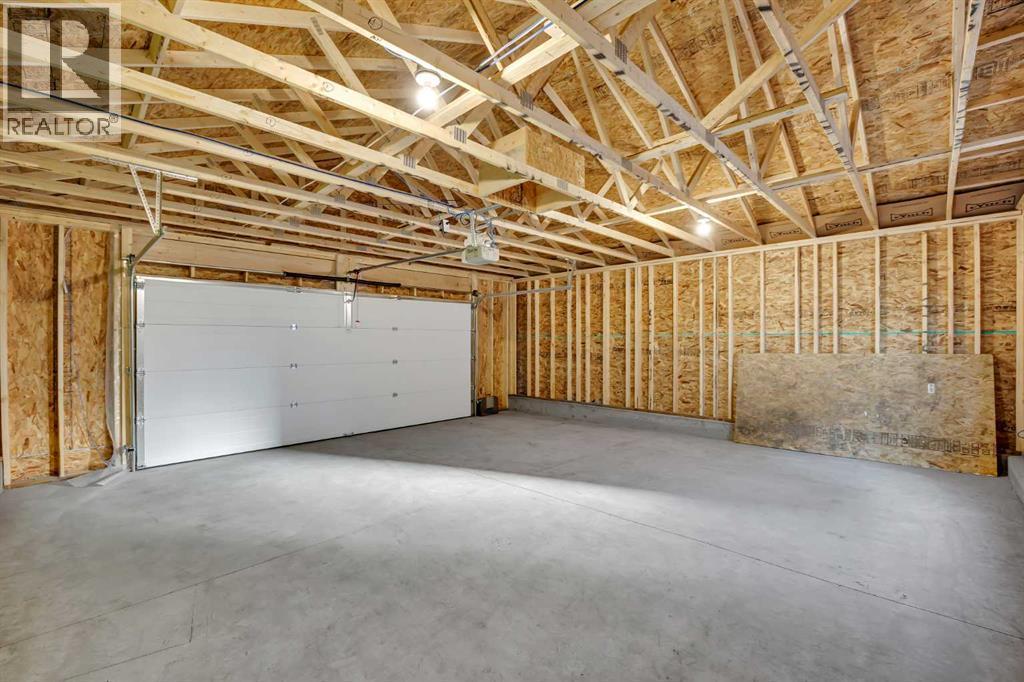 26 Versant Path Sw, Calgary, AB - Indoor Photo Showing Garage