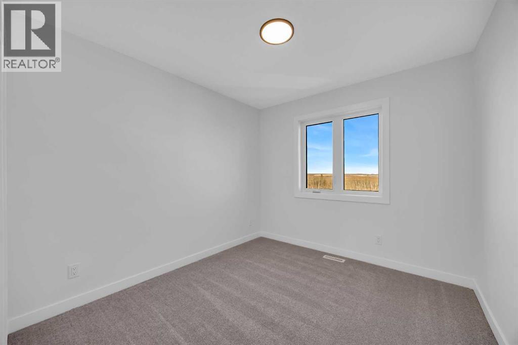 14 Versant Path Sw, Calgary, AB - Indoor Photo Showing Other Room
