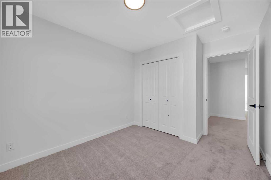 14 Versant Path Sw, Calgary, AB - Indoor Photo Showing Other Room