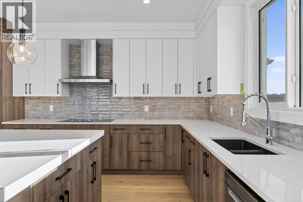 202 Kinniburgh Loop, Chestermere, AB - Indoor Photo Showing Kitchen With Double Sink With Upgraded Kitchen