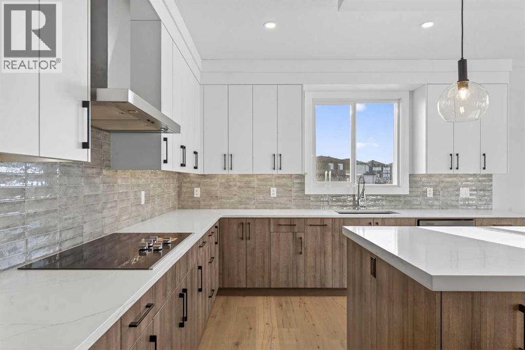 202 Kinniburgh Loop, Chestermere, AB - Indoor Photo Showing Kitchen With Upgraded Kitchen