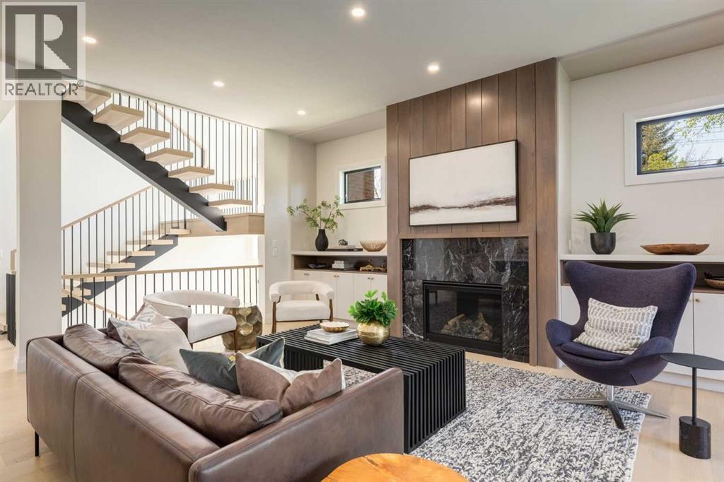 Photo of a previous build by Agile Developments (Elbow Park) - 1603 42 Avenue Sw, Calgary, AB - Indoor Photo Showing Living Room With Fireplace