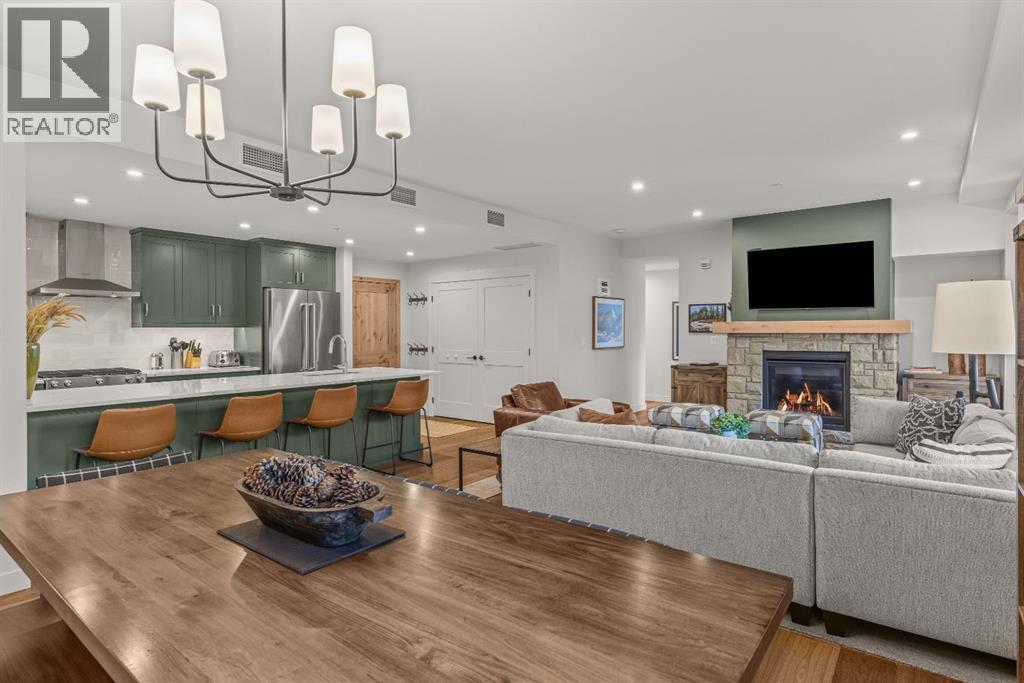 313, 1408 Spring Creek Gate, Canmore, AB - Indoor With Fireplace