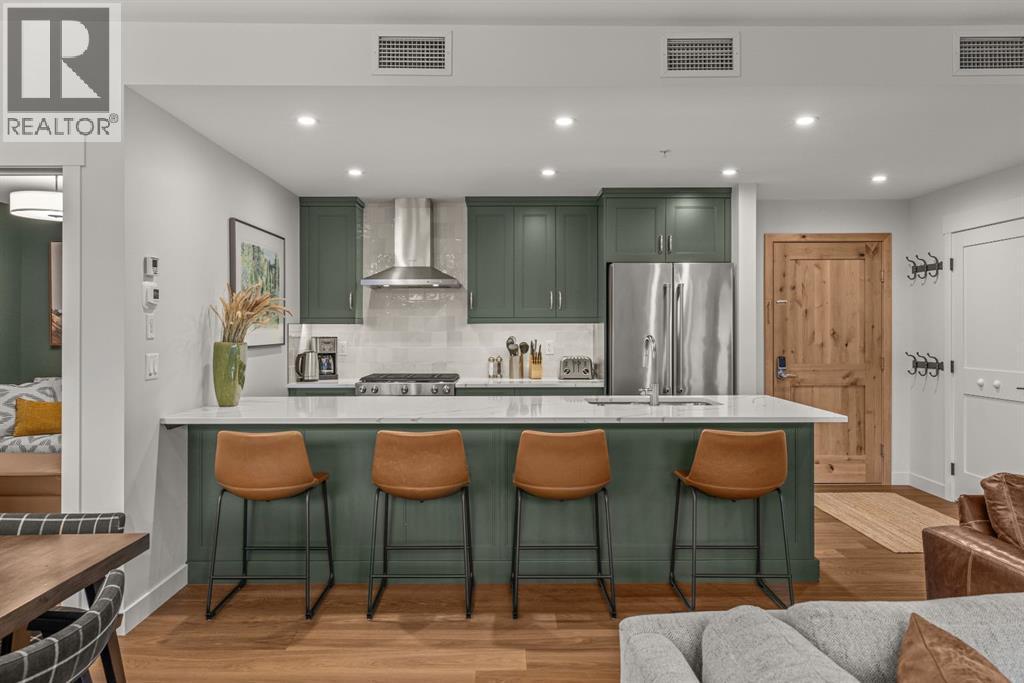 Large eating bar - 313, 1408 Spring Creek Gate, Canmore, AB - Indoor Photo Showing Other Room