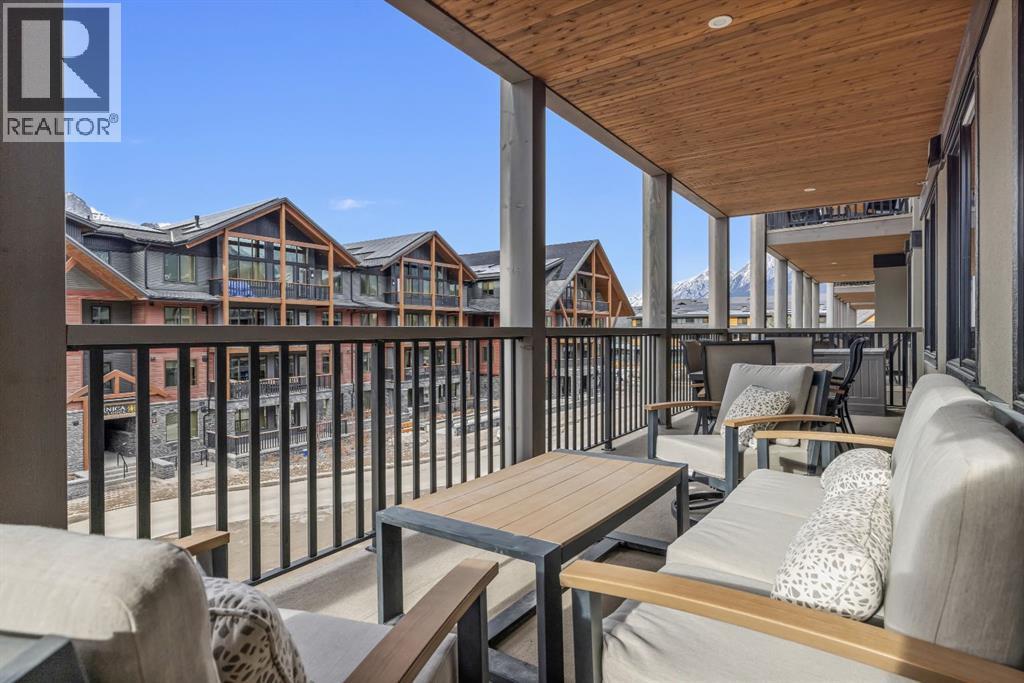 313, 1408 Spring Creek Gate, Canmore, AB - Outdoor With Deck Patio Veranda With Exterior