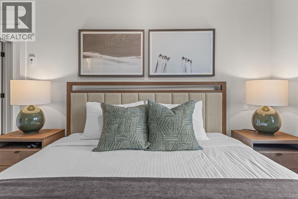 313, 1408 Spring Creek Gate, Canmore, AB - Indoor Photo Showing Bedroom