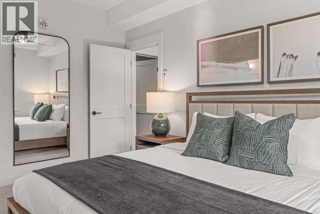 313, 1408 Spring Creek Gate, Canmore, AB - Indoor Photo Showing Bedroom