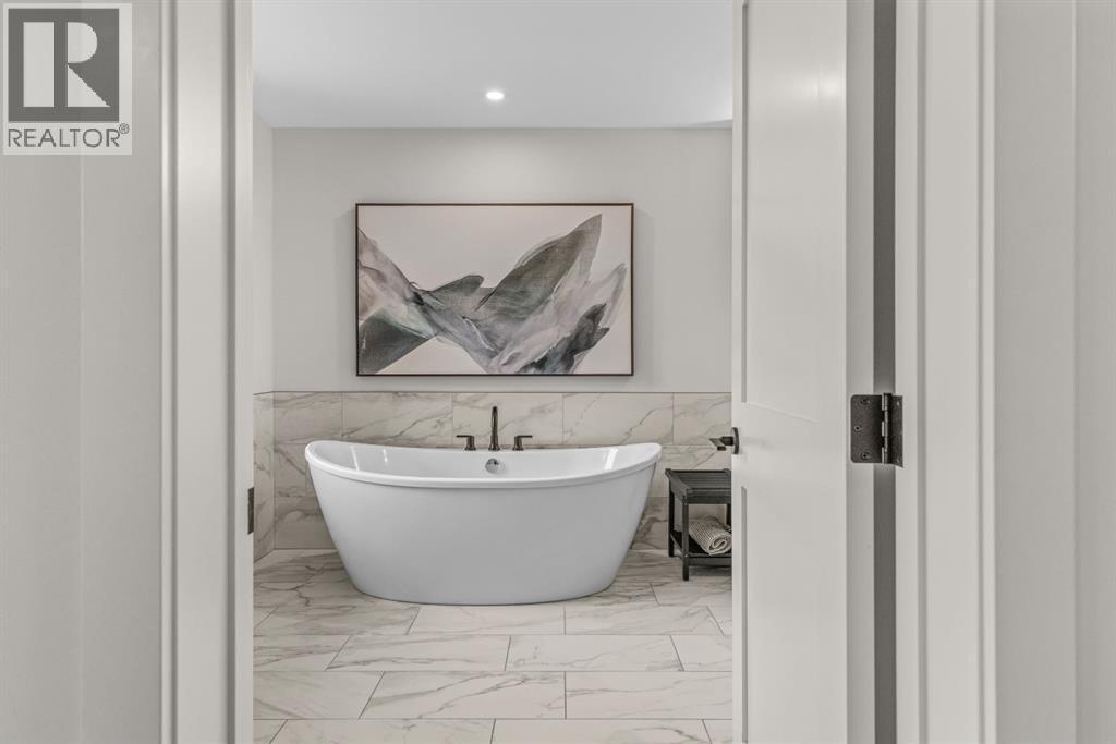 The first of two ensuites - 313, 1408 Spring Creek Gate, Canmore, AB - Indoor Photo Showing Bathroom