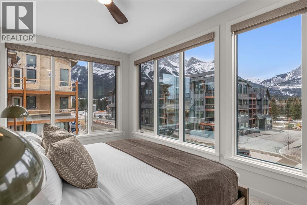 Primary bedroom #2 - 313, 1408 Spring Creek Gate, Canmore, AB - Indoor Photo Showing Bedroom