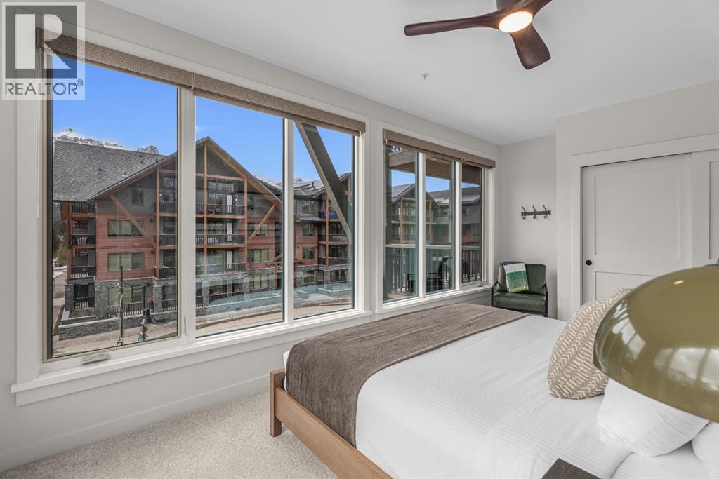 313, 1408 Spring Creek Gate, Canmore, AB - Indoor Photo Showing Bedroom