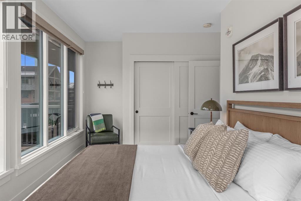 313, 1408 Spring Creek Gate, Canmore, AB - Indoor Photo Showing Bedroom