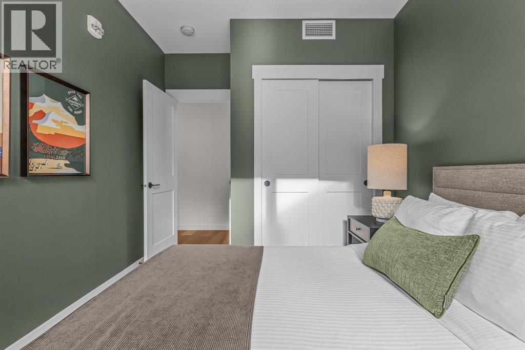 313, 1408 Spring Creek Gate, Canmore, AB - Indoor Photo Showing Bedroom