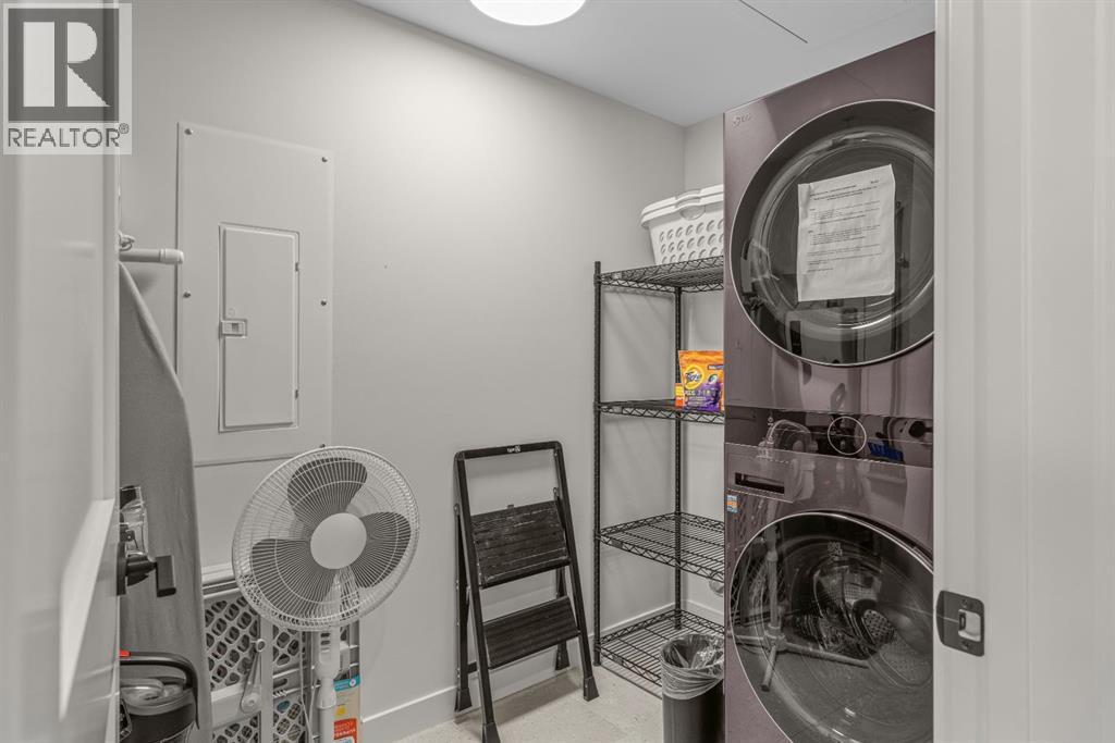 313, 1408 Spring Creek Gate, Canmore, AB - Indoor Photo Showing Laundry Room