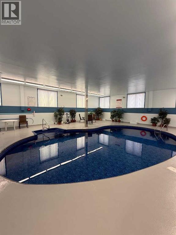 312, 75 Temple Boulevard W, Lethbridge, AB - Indoor Photo Showing Other Room With In Ground Pool