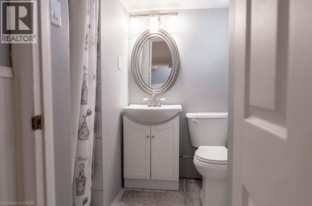 Bathroom with toilet and vanity - 854 West 5Th Street, Hamilton, ON - Indoor Photo Showing Bathroom
