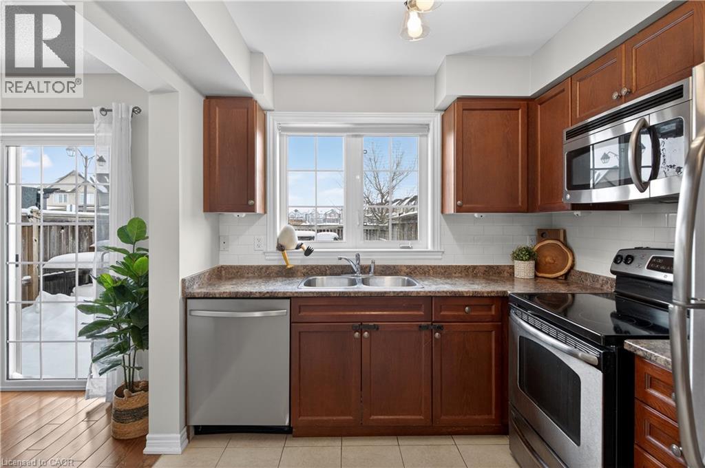 222 Fall Fair Way Unit# 64, Binbrook, ON - Indoor Photo Showing Kitchen With Stainless Steel Kitchen With Double Sink