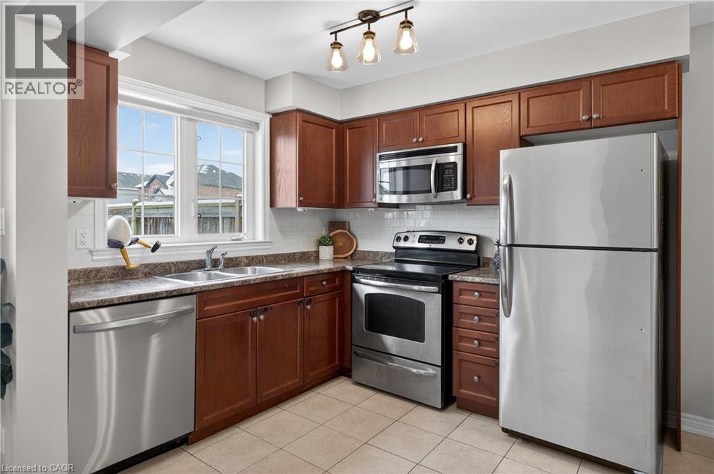 222 Fall Fair Way Unit# 64, Binbrook, ON - Indoor Photo Showing Kitchen With Stainless Steel Kitchen With Double Sink