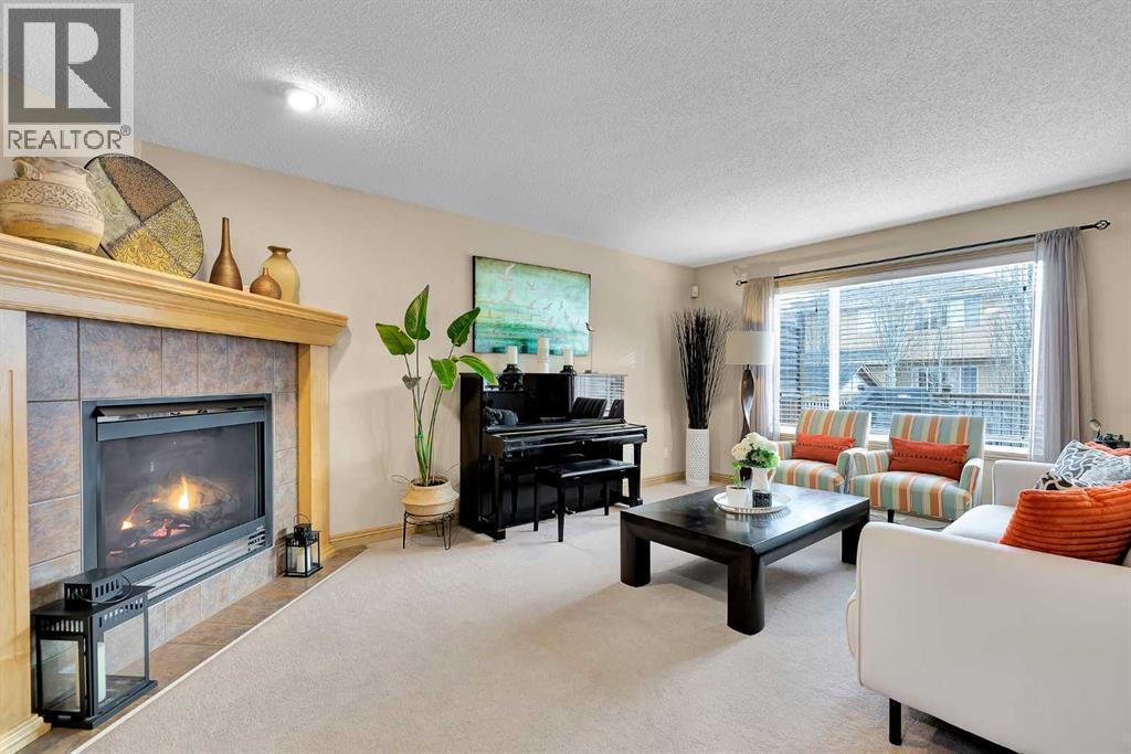 270 Everstone Drive Sw, Calgary, AB - Indoor Photo Showing Living Room With Fireplace