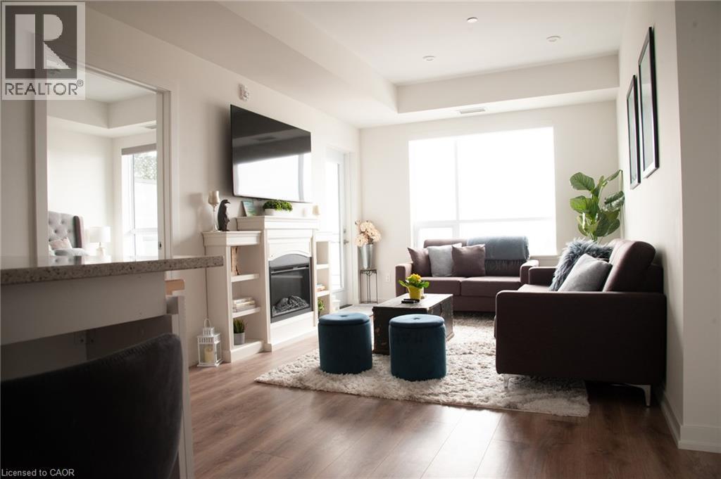255 Northfield Drive E Unit# 506, Waterloo, ON - Indoor Photo Showing Living Room With Fireplace