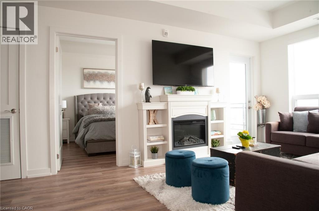 255 Northfield Drive E Unit# 506, Waterloo, ON - Indoor Photo Showing Living Room With Fireplace