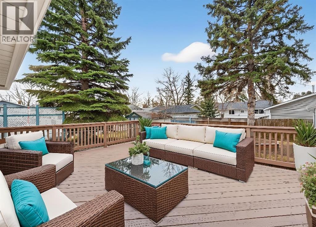 Virtually Staged - 127 Lynnview Way Se, Calgary, AB - Outdoor With Deck Patio Veranda