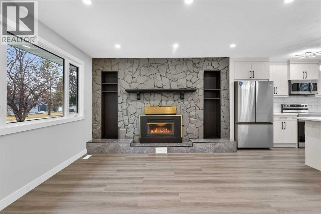 127 Lynnview Way Se, Calgary, AB - Indoor With Fireplace