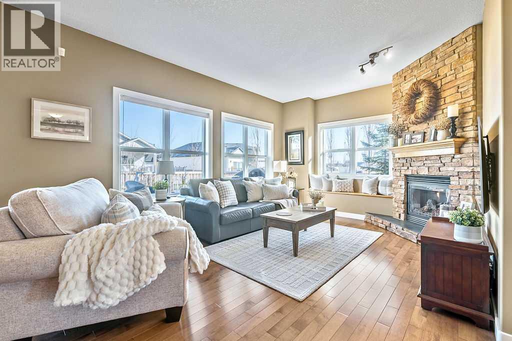 718 Hamptons Bay Se, High River, AB - Indoor Photo Showing Living Room With Fireplace