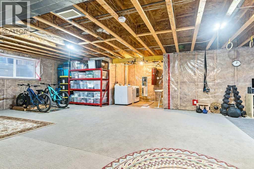 718 Hamptons Bay Se, High River, AB - Indoor Photo Showing Basement