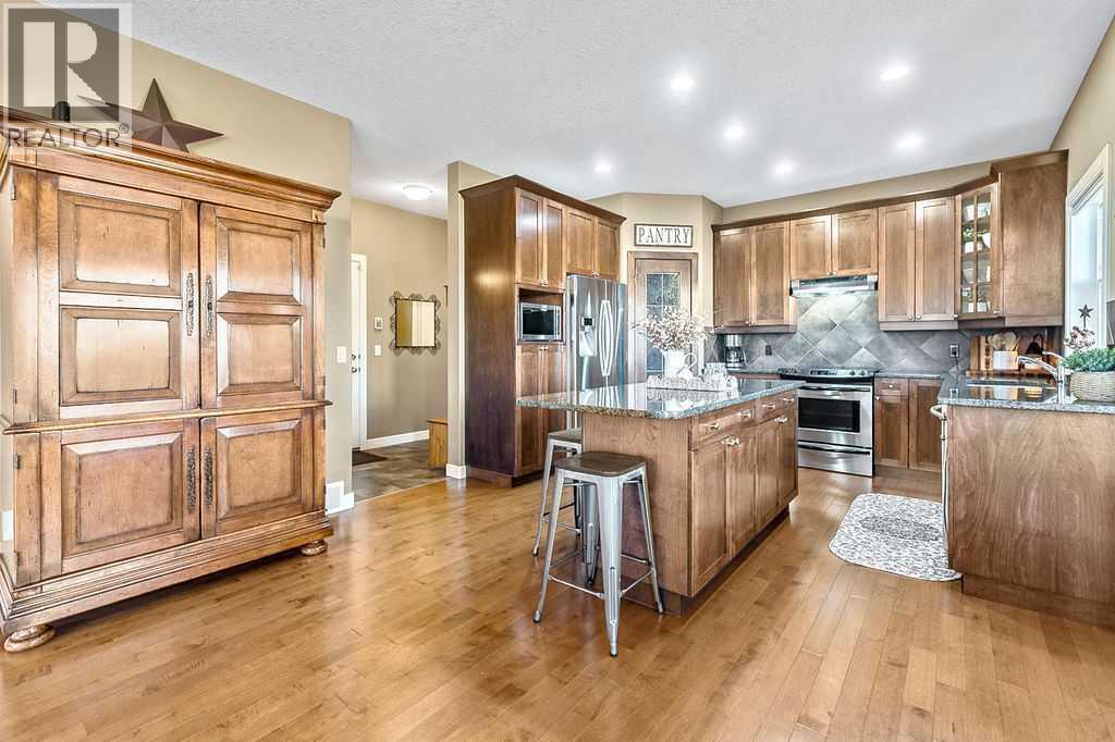 718 Hamptons Bay Se, High River, AB - Indoor Photo Showing Kitchen With Stainless Steel Kitchen