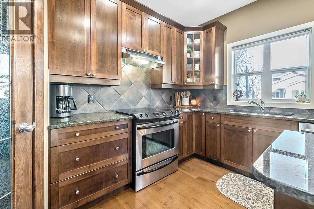 718 Hamptons Bay Se, High River, AB - Indoor Photo Showing Kitchen With Stainless Steel Kitchen With Double Sink